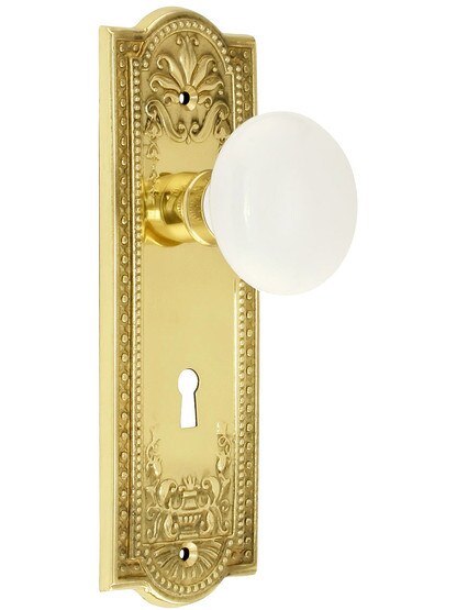 Meadows Style Mortise Lock Set in Polished Brass Finish with White Porcelain Door Knobs.